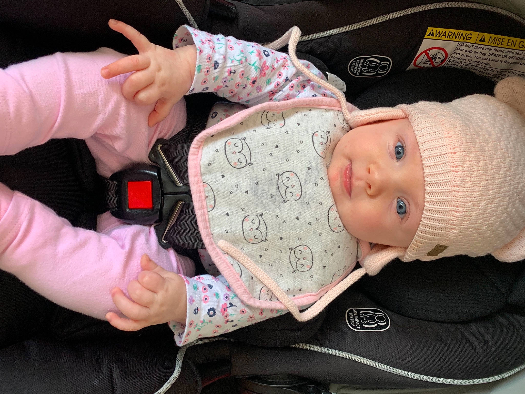 Holly joined the competition — help win amazing prizes! arm, baby, baby_carriage, baby_products, baby_sleeping, baby_toddler_clothing, beanie, cap, child, comfort, finger, gesture, hand, headwear, human_body, person, pink, sitting, sleeve, thumb