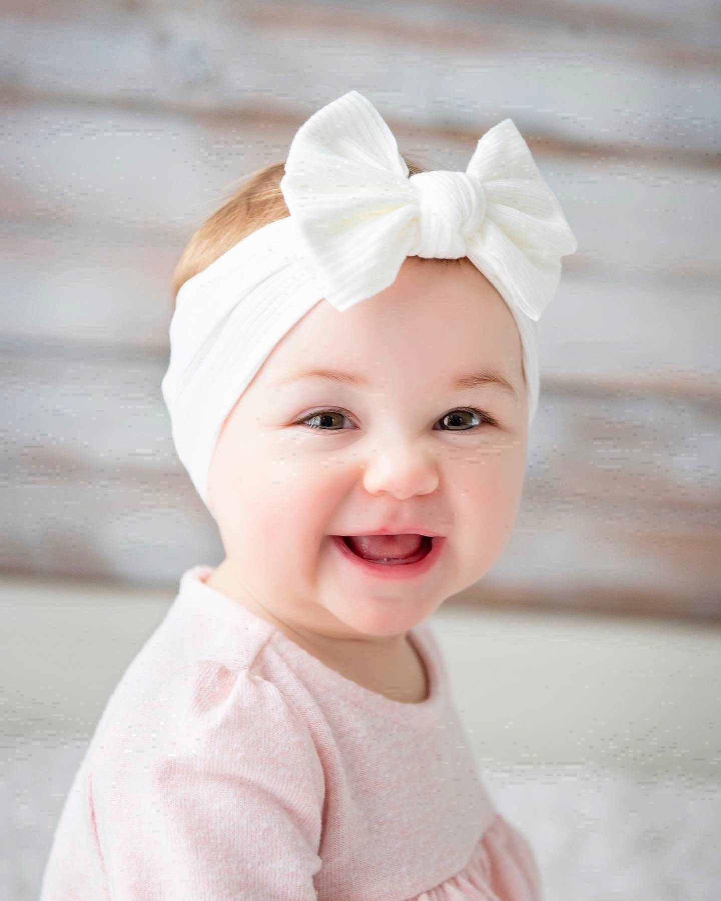 Kamryn is registered to the contest to win money with this photo: baby, baby_toddler_clothing, bridal_accessory, cap, child, fashion_accessory, flash_photography, hair_accessory, happy, head, headband, headgear, headpiece, headwear, joy, lip, pattern, peach, person, pink