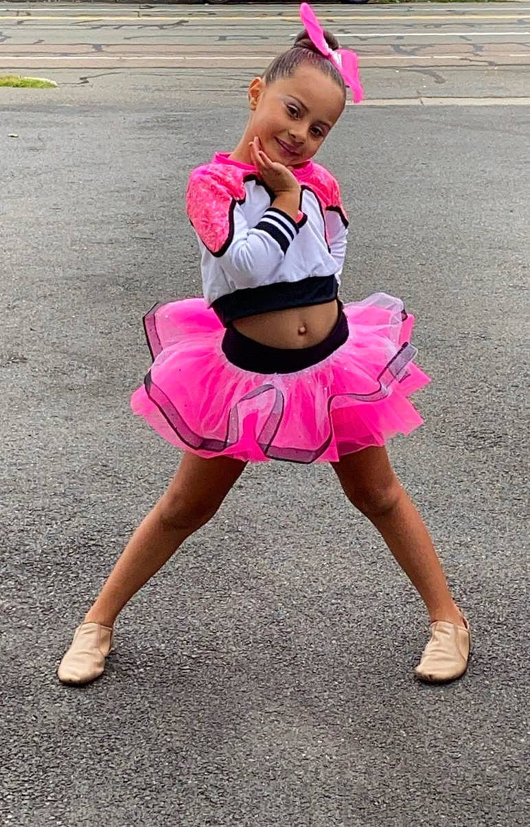 Salome joined the competition — help win amazing prizes! barefoot, face, fun, happy, headgear, human_leg, joy, leg, leisure, magenta, person, pink, recreation, sandal, shoe, shorts, smile, street_fashion, thigh, toddler