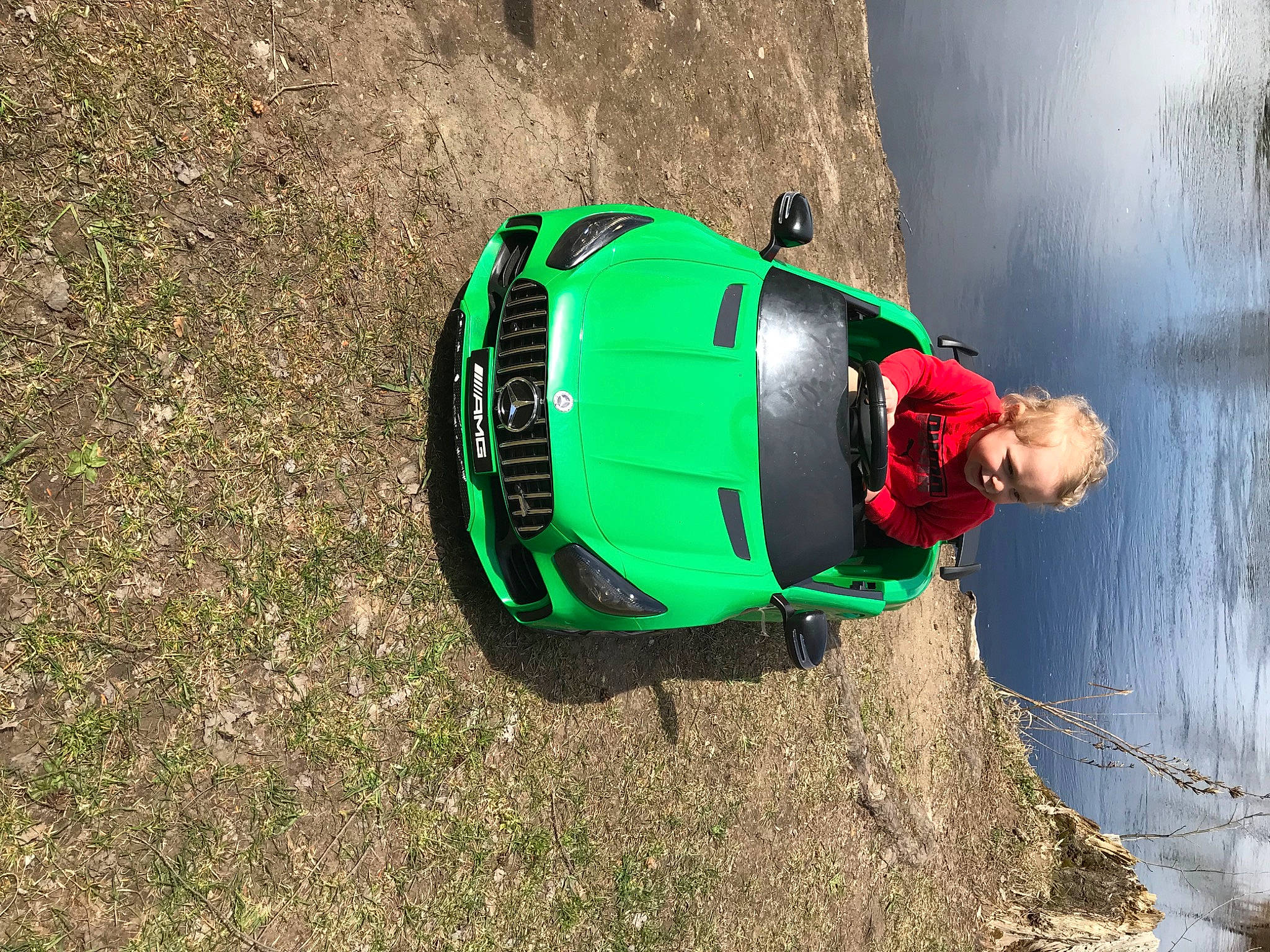 Zadrian is registered to the contest to win money with this photo: asphalt, automotive_design, automotive_exterior, automotive_lighting, automotive_tire, car, grass, hood, landscape, motor_vehicle, person, personal_protective_equipment, racing, recreation, road, slope, tire, vehicle, water, wheel