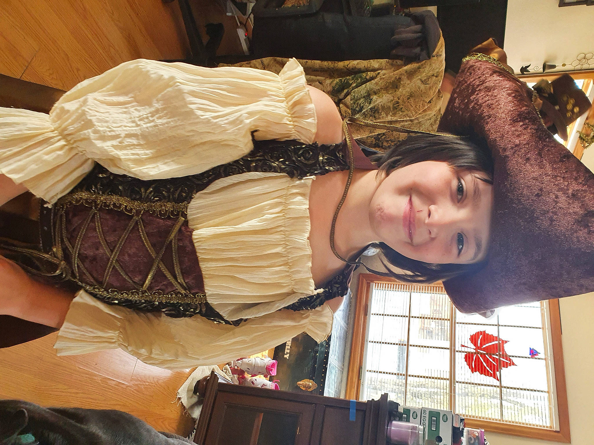 Helynn is registered to the contest to win money with this photo: abdomen, comfort, costume, costume_design, dress, event, fashion_design, flesh, fun, happy, headwear, joy, person, room, smile, vintage_clothing, wood