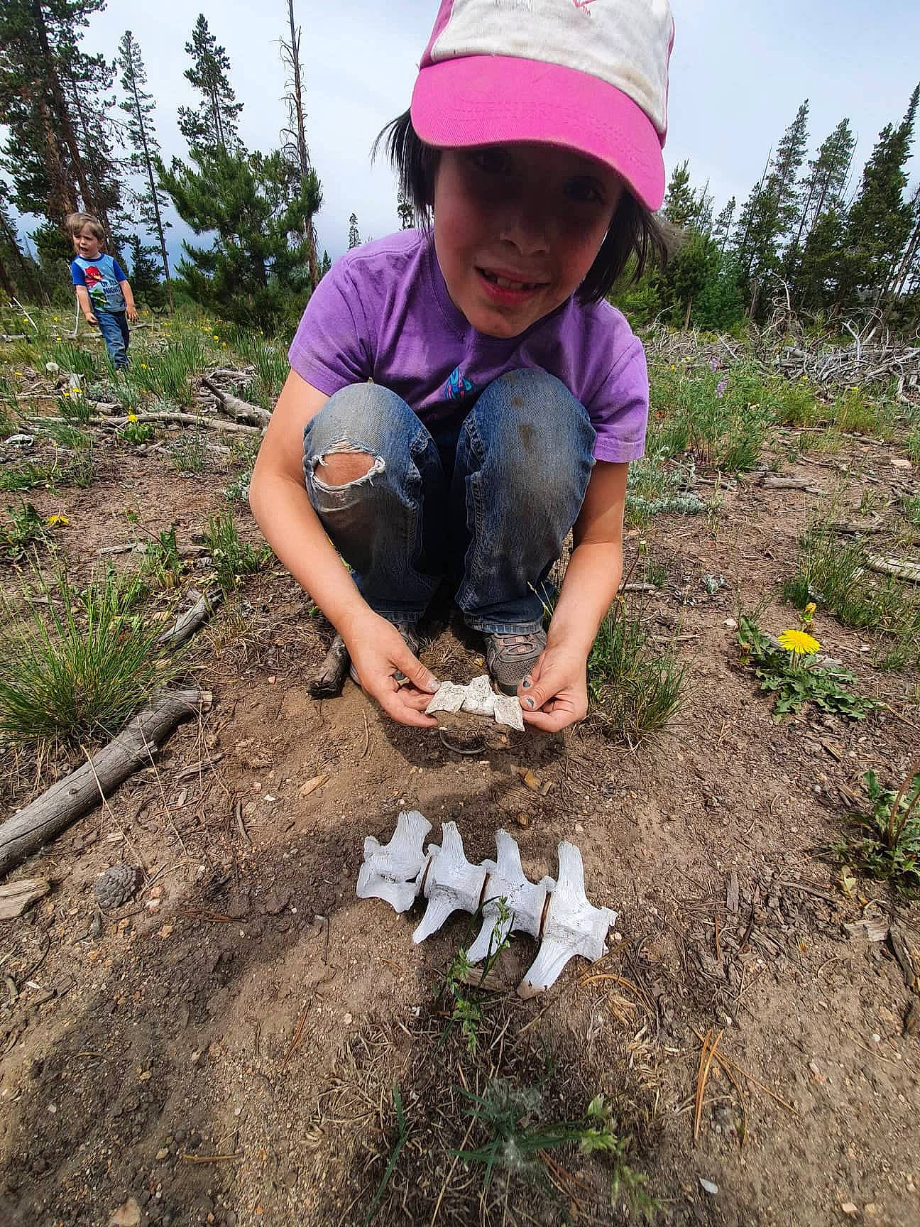 Helynn joined the competition — help win amazing prizes! baseball_cap, cap, fun, grass, grassland, happy, headwear, helmet, landscape, leisure, natural_environment, people_in_nature, person, petal, plant, recreation, sandal, shorts, sky, soil