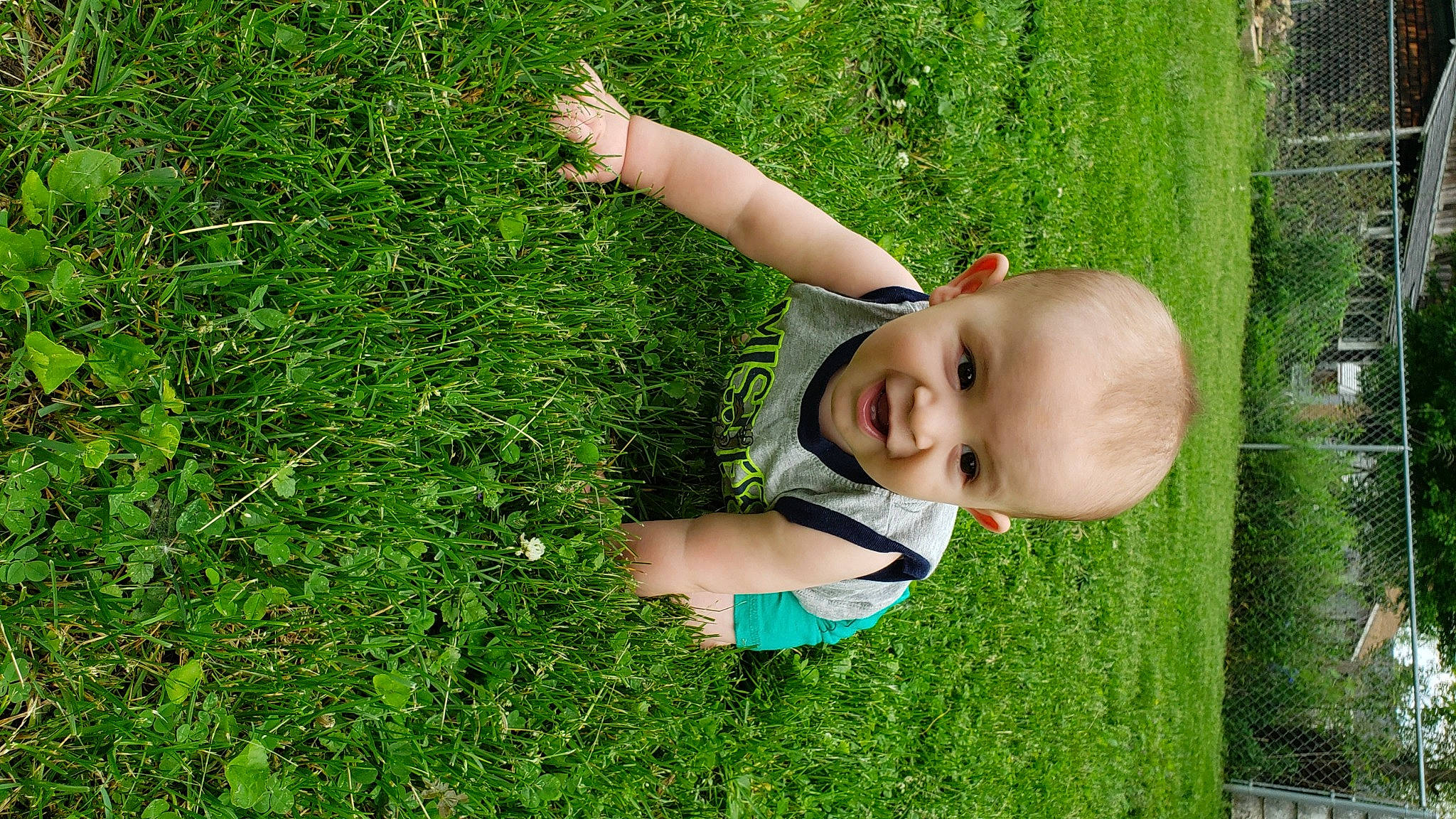 Brantlee is registered to the contest to win money with this photo: baby, botany, finger, fun, grass, grass_family, grassland, green, groundcover, happy, human_body, lawn, leaf, meadow, natural_environment, people_in_nature, person, plant, shrub, toddler