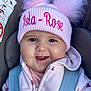 baby, car_seat, child, childrens_fashion, closeup, clothing, cute, face, happy, headwear, hoodie, infant, pink_hat, pom_pom, portrait, seatbelt, smiling, warm_clothes, young_child, zipper