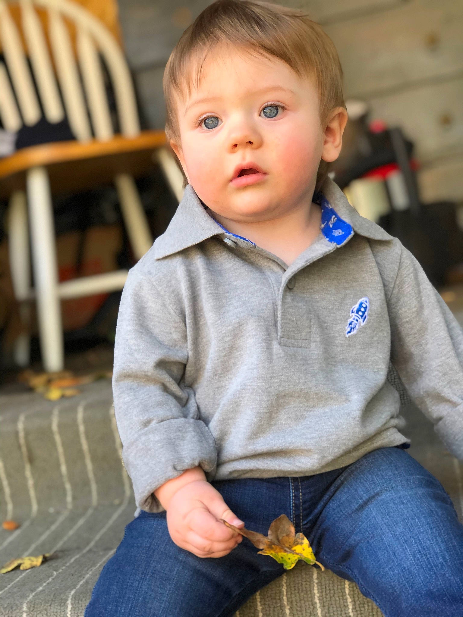 Kelly is registered to the contest to win money with this photo: baby, cheek, child, child_model, eye, face, jeans, male, person, sitting, skin, smile, toddler