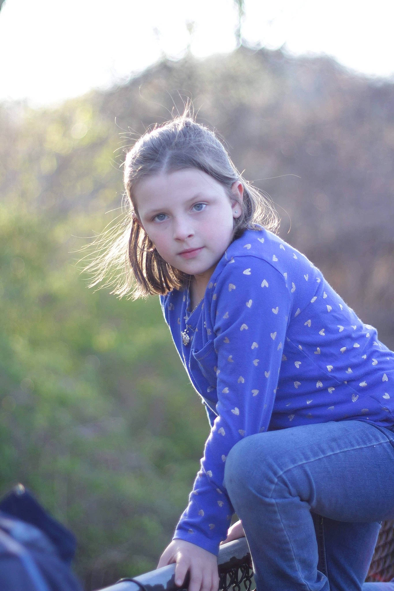 Daniella is registered to the contest to win money with this photo: blond, brown_hair, child, denim, electric_blue, eye, flash_photography, fun, grass, grassland, hairstyle, happy, leisure, long_hair, pattern, people_in_nature, person, recreation, sitting, street_fashion