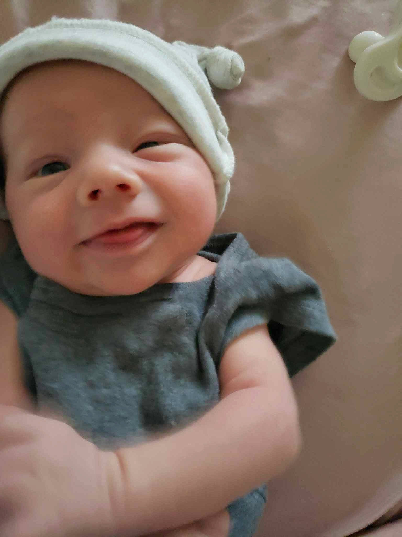 Joshua Jr is registered to the contest to win money with this photo: baby, baby_laughing, baby_toddler_clothing, cap, cheek, child, eye, fun, gesture, grass, happy, hat, iris, lip, mouth, nose, person, skin, sleeve, smile