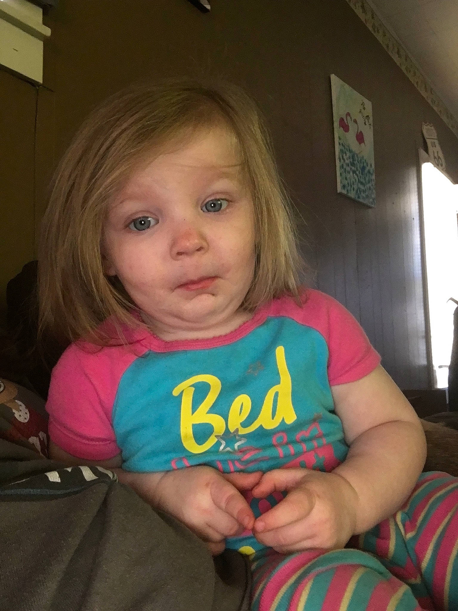 Novalee is registered to the contest to win money with this photo: blond, cheek, child, eye, face, finger, fun, iris, person, play, sitting, skin, smile, toddler, tooth