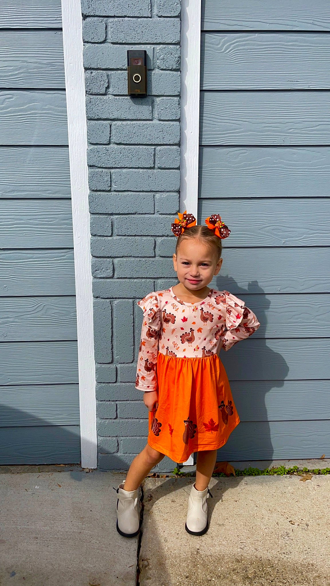 Arabella joined the competition — help win amazing prizes! baby_toddler_clothing, brick, child, clothing, door, eyewear, fashion_design, happy, hat, jewellery, joy, magenta, orange, pattern, peach, person, pink, sandal, sleeve, smile