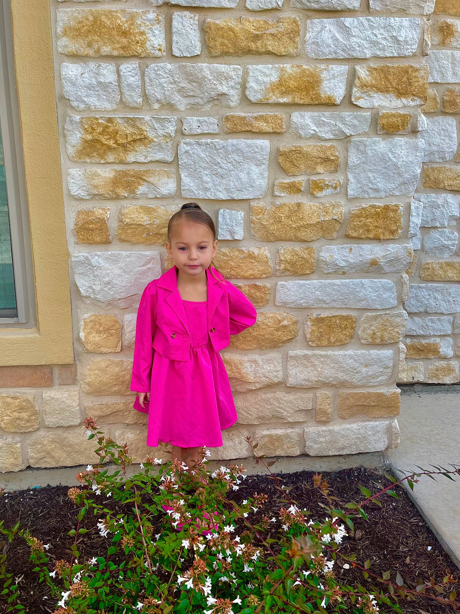 Arabella is registered to the contest to win money with this photo: brick, child, door, flooring, flower, grass, happy, joy, magenta, pattern, people_in_nature, person, pink, plant, purple, red, shrub, sleeve, tints_and_shades, toddler