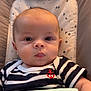 Manéo participe au concours pour gagner de l'argent avec cette photo : baby, infant, face, eyes, drool, striped_shirt, anchor_emblem, blanket, cushion, comfort, child, portrait, young, cute, indoors, soft_lighting, head, clothing, resting, closeup