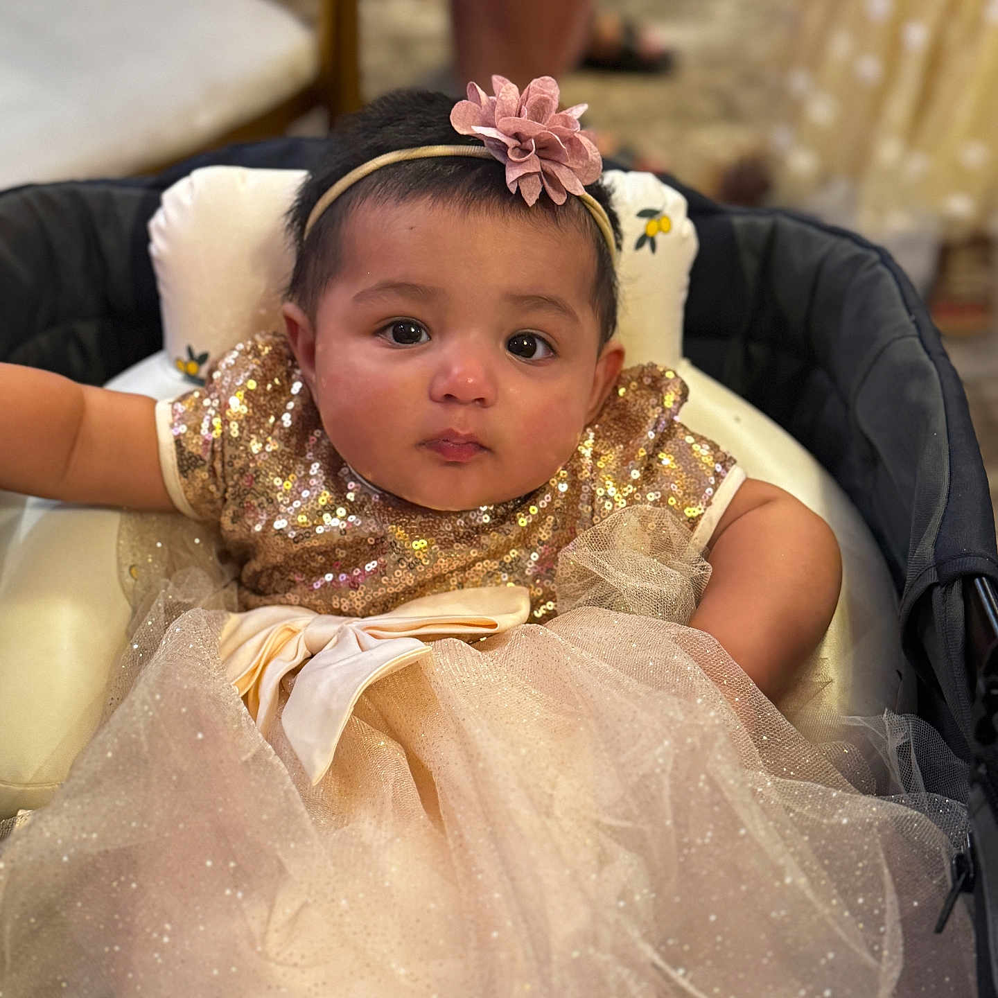 Arshiya joined the competition — help win amazing prizes! adorable, baby, bow, child, clothing, cushion, cute, dress, expression, eyes, face, flower, headband, indoor, infant, person, portrait, seated, soft_focus, sparkle