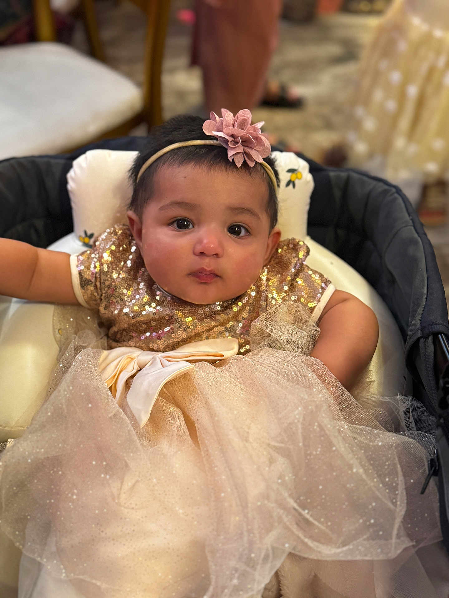 Arshiya joined the competition — help win amazing prizes! baby, child, infant, dress, sparkle, bow, headband, flower, seated, cushion, face, eyes, expression, cute, indoor, soft_focus, person, portrait, adorable, clothing