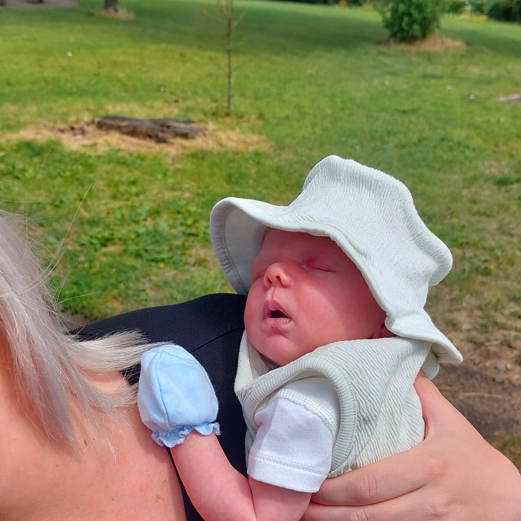 Noah joined the competition — help win amazing prizes! baby, baby_products, baby_toddler_clothing, cap, child, fashion_accessory, fedora, finger, fun, gesture, grass, hand, happy, hat, leisure, people_in_nature, person, sitting, sun_hat, thumb