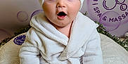 Theodore joined the competition — help win amazing prizes! baby, child, blue_eyes, white_robe, towel_turban, surprised_expression, sitting, soft_blanket, spa_theme, bubbles, indoor, cute, portrait, infant, skin, hands, feet, comfort, relaxation, plush