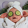 Theodore is registered to the contest to win money with this photo: baby, child, towel, cucumber_slices, spa, relaxation, face, skin_care, robe, headwrap, hands, indoor, cute, funny, wellness, pampering, portrait, person, closeup, healthy