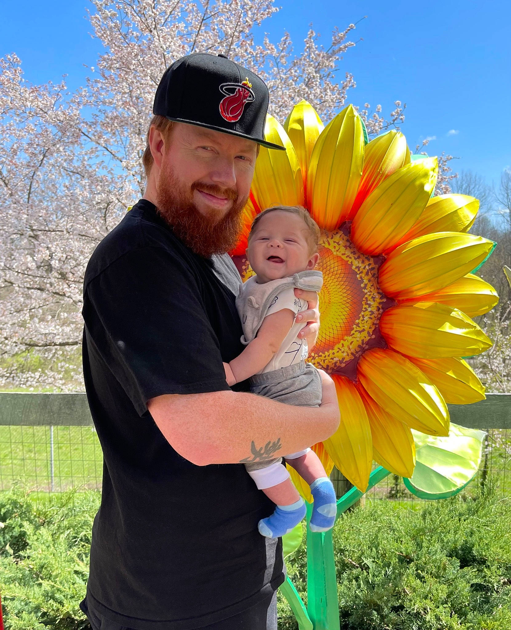 Cade joined the competition — help win amazing prizes! baseball_cap, botany, cap, event, flower, fun, gesture, grass, happy, hat, headwear, joy, leisure, people_in_nature, person, plant, recreation, sky, smile, t_shirt