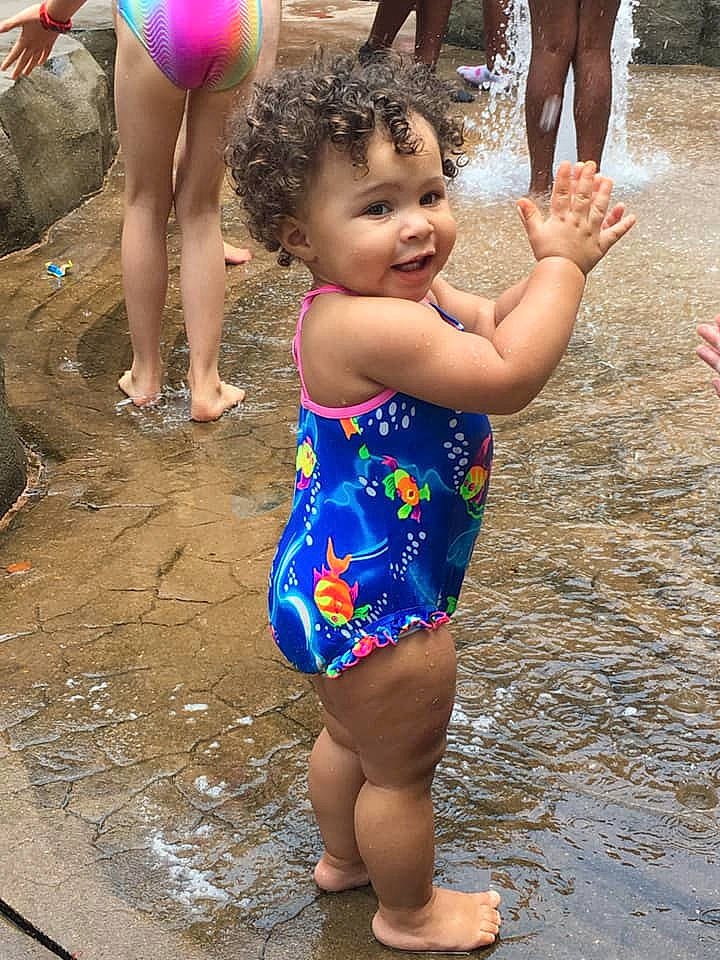 Adalee is registered to the contest to win money with this photo: barefoot, bathing, child, fun, happy, leisure, leotard, person, play, recreation, smile, summer, swimwear, toddler, vacation, water, water_park