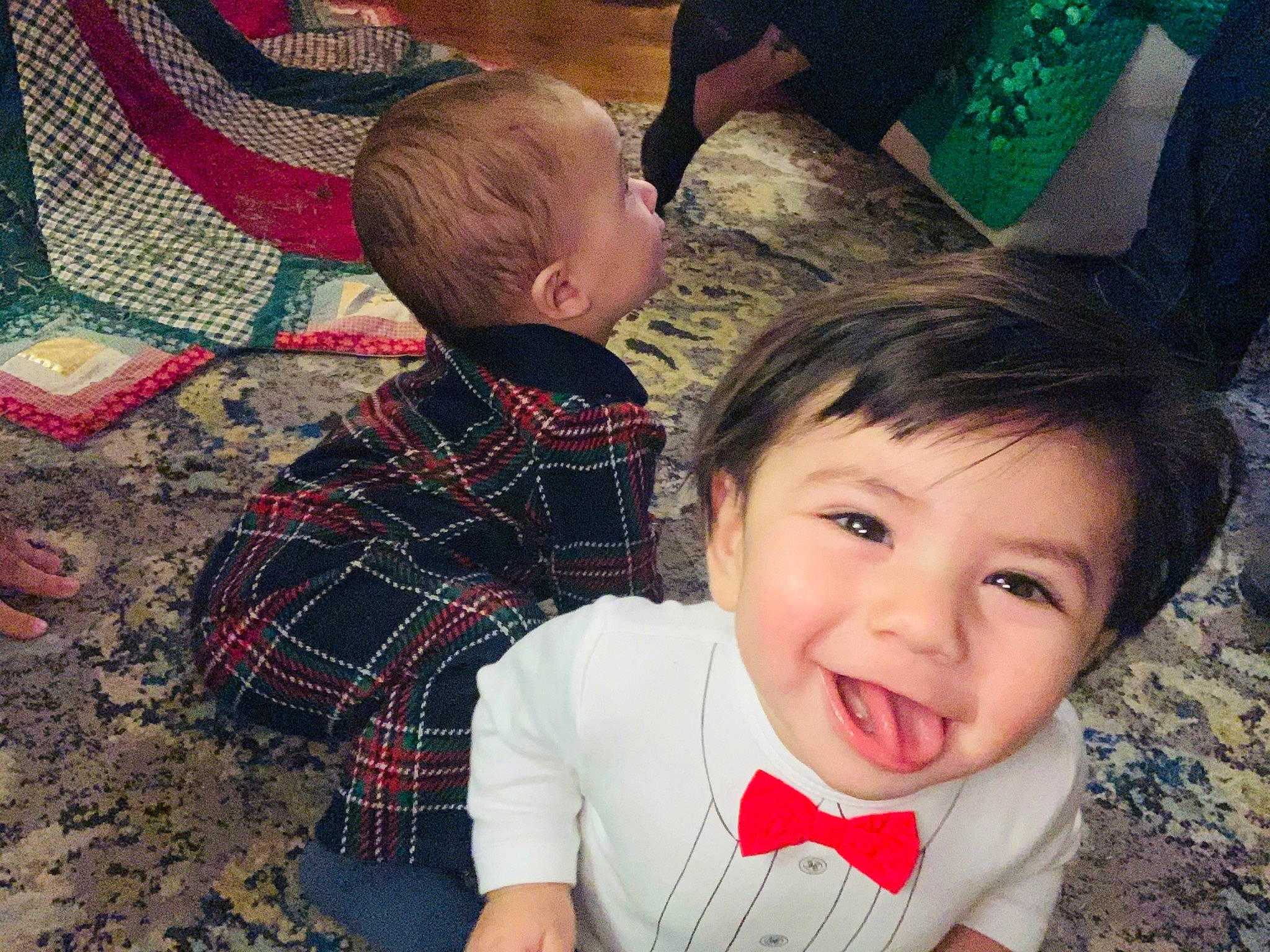 Rocky is registered to the contest to win money with this photo: baby, baby_products, baby_toddler_clothing, cheek, child, ear, head, human, interaction, joy, love, mammal, pattern, person, plaid, quilt, tartan, toddler, tongue, tooth