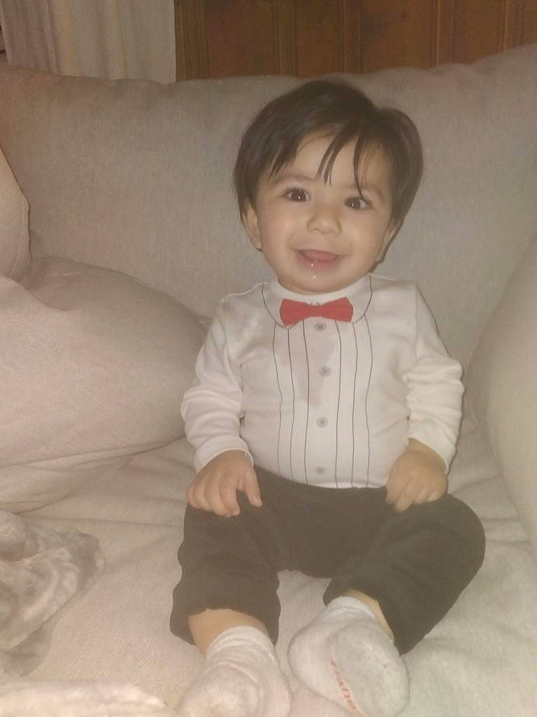 Rocky joined the competition — help win amazing prizes! baby, baby_toddler_clothing, cheek, child, comfort, couch, foot, joy, living_room, long_sleeved_t_shirt, person, sitting, skin, sleeve, slipcover, sock, toddler