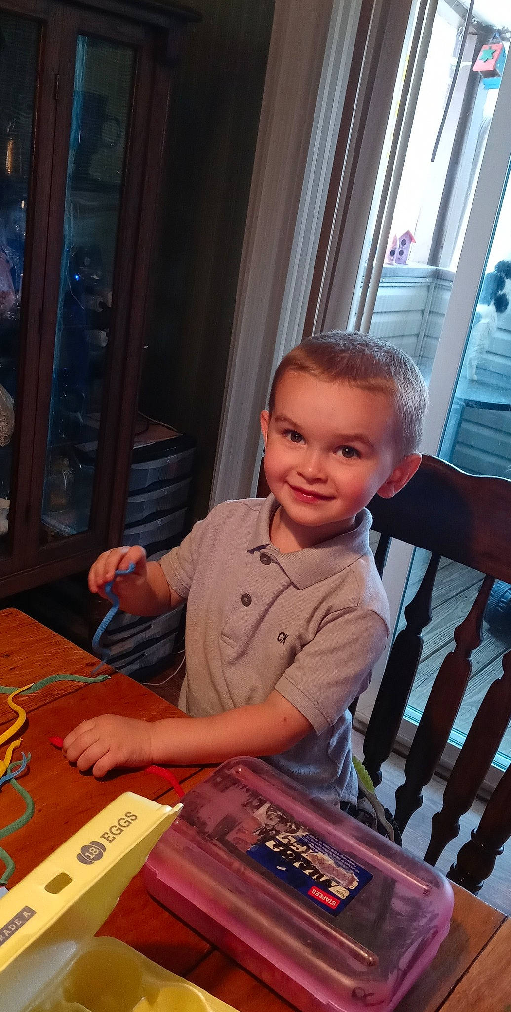 Andrew joined the competition — help win amazing prizes! artist, box, chair, child, desk, fun, gadget, indoor_games_and_sports, joy, person, play, recreation, room, sitting, smile, t_shirt, table, toddler, varnish, wood