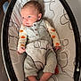 William joined the competition — help win amazing prizes! baby, infant, baby_rocker, clothing, gray_outfit, pumpkin_pattern, feet, toes, face, indoor, wooden_floor, baby_gadget, comfort, newborn, cute, resting, person, child, seat, home