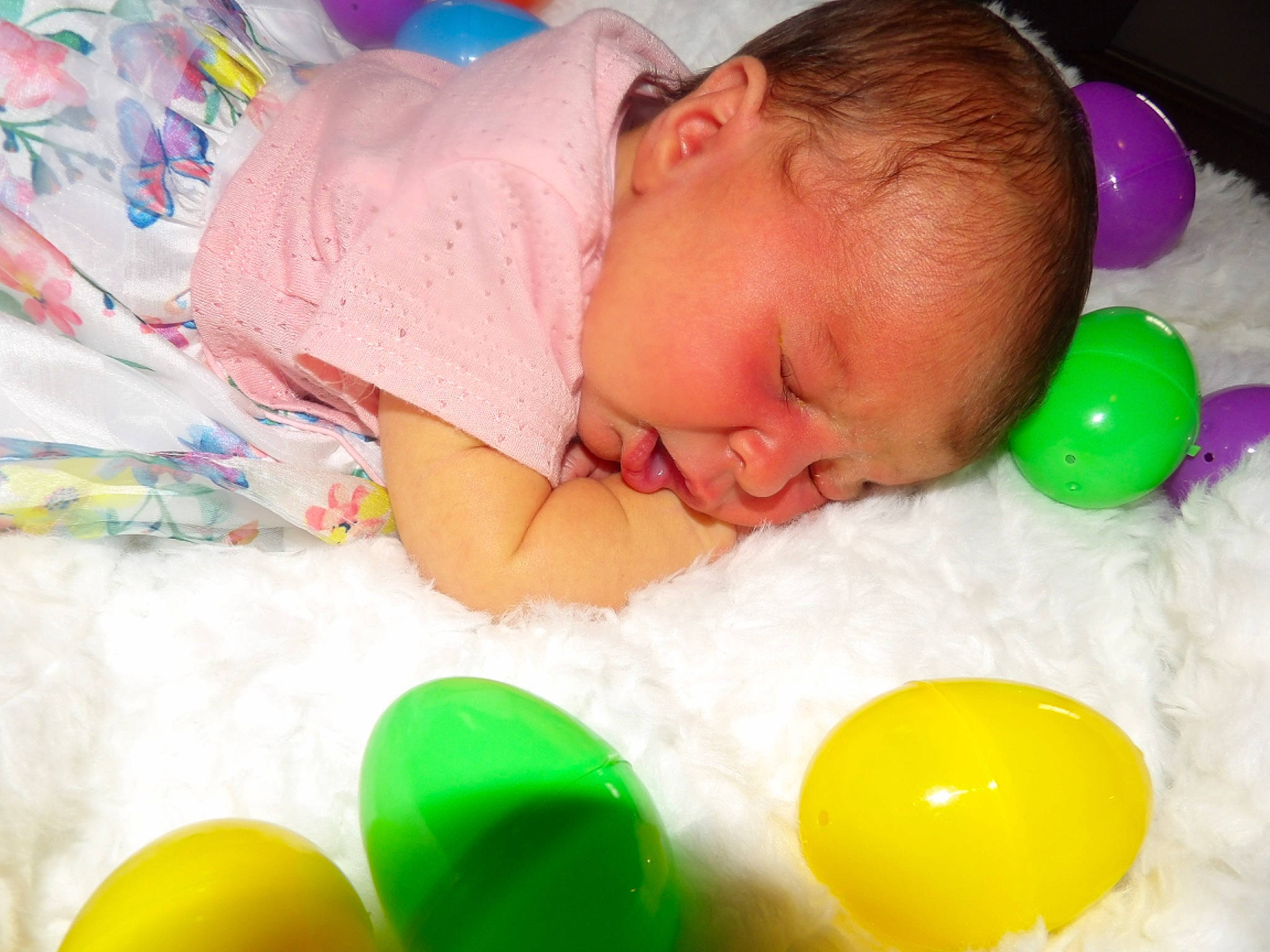 Daphne is registered to the contest to win money with this photo: baby, baby_playing_with_toys, baby_products, baby_toddler_clothing, ball_pit, balloon, child, comfort, event, facial_expression, fun, linens, party_supply, person, play, room, textile, toddler, toy, white