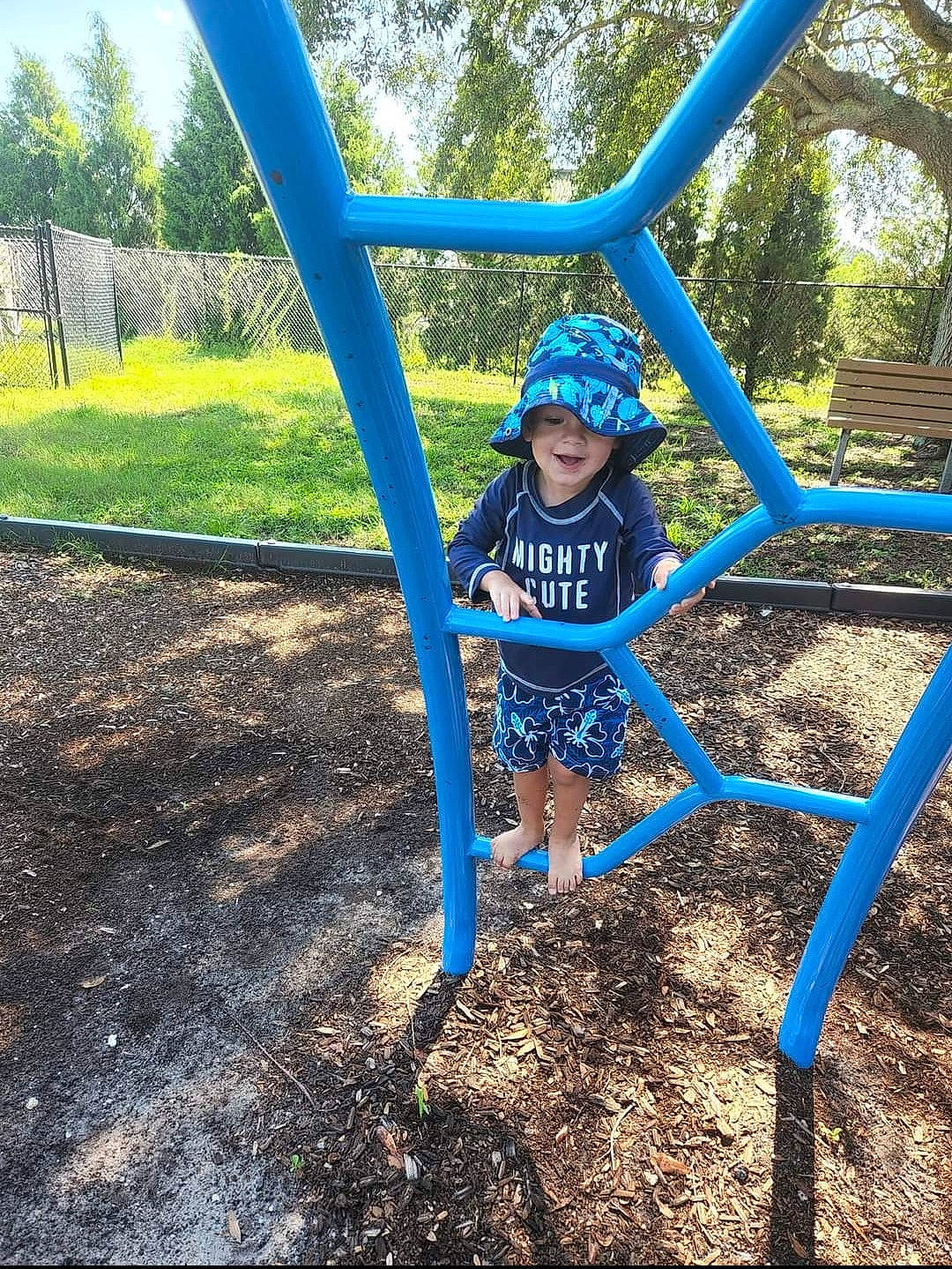 Titus joined the competition — help win amazing prizes! child, chute, city, electric_blue, fun, grass, headwear, leisure, outdoor_play_equipment, person, plant, play, playground, recreation, shade, shorts, soil, swing, t_shirt, toddler