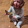 baby, child, toddler, sitting, indoors, kitchen, floor, wooden_floor, wooden_spoon, earmuffs, furry_earmuffs, gray_clothing, onesie, white_socks, cat, pet, cooking, pan, portrait, cute
