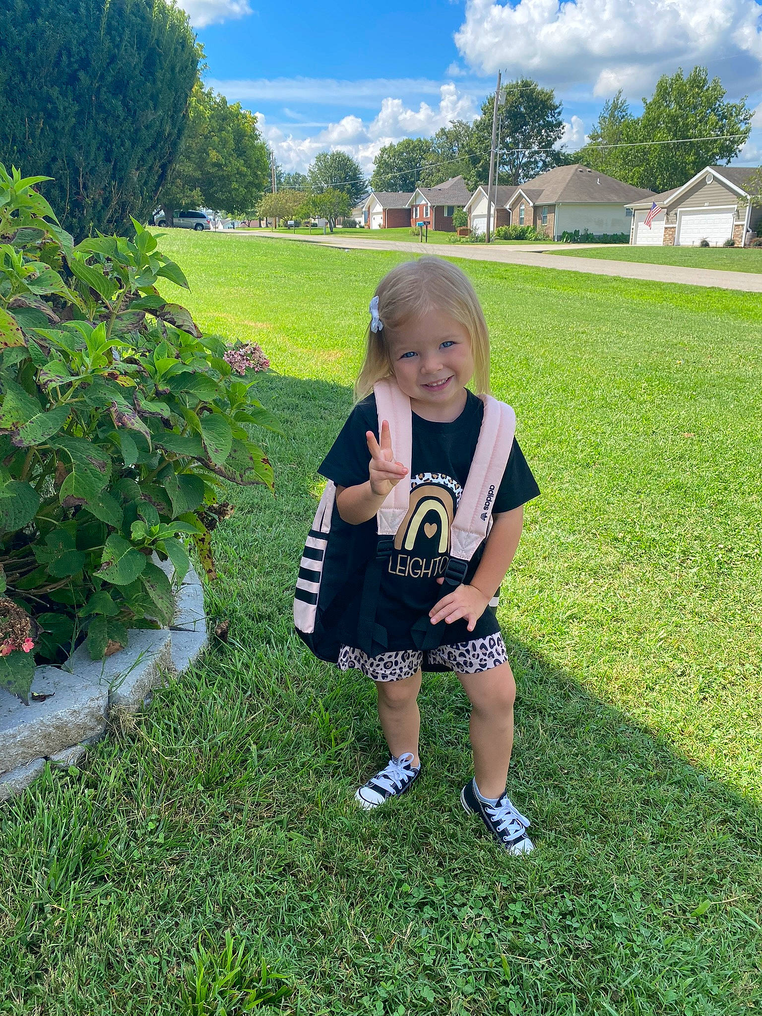 Leighton is registered to the contest to win money with this photo: baby_toddler_clothing, cloud, grass, grass_family, grassland, groundcover, happy, joy, lawn, leaf, leisure, meadow, natural_environment, nature, people_in_nature, person, plant, shorts, sky, smile