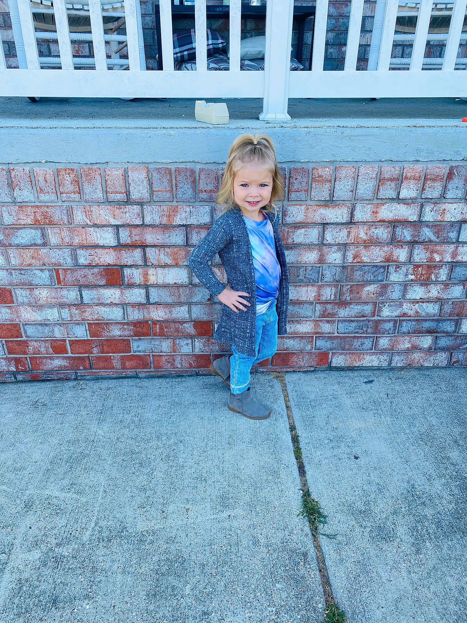 Leighton is registered to the contest to win money with this photo: asphalt, baby_toddler_clothing, brick, brickwork, cobblestone, concrete, denim, electric_blue, flooring, grass, joy, leisure, pattern, people_in_nature, person, plant, road_surface, sidewalk, sitting, stairs