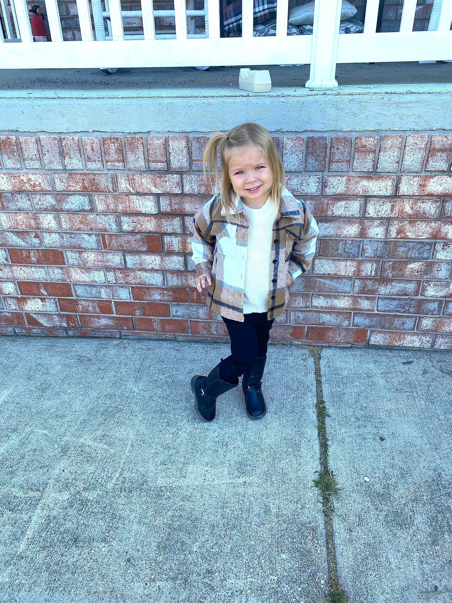 Leighton joined the competition — help win amazing prizes! brick, child, denim, electric_blue, flooring, fun, grass, happy, jacket, joy, leisure, pattern, person, road_surface, shadow, sidewalk, sitting, smile, symmetry, toddler