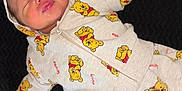 Owenn a rejoint le concours — aidez-le/la à gagner de superbes lots ! baby, newborn, infant, sleeping, onesie, winnie_the_pooh, clothing, hoodie, cute, peaceful, face, hand, blanket, soft, child, portrait, lying_down, infant_clothing, baby_garment, adorable