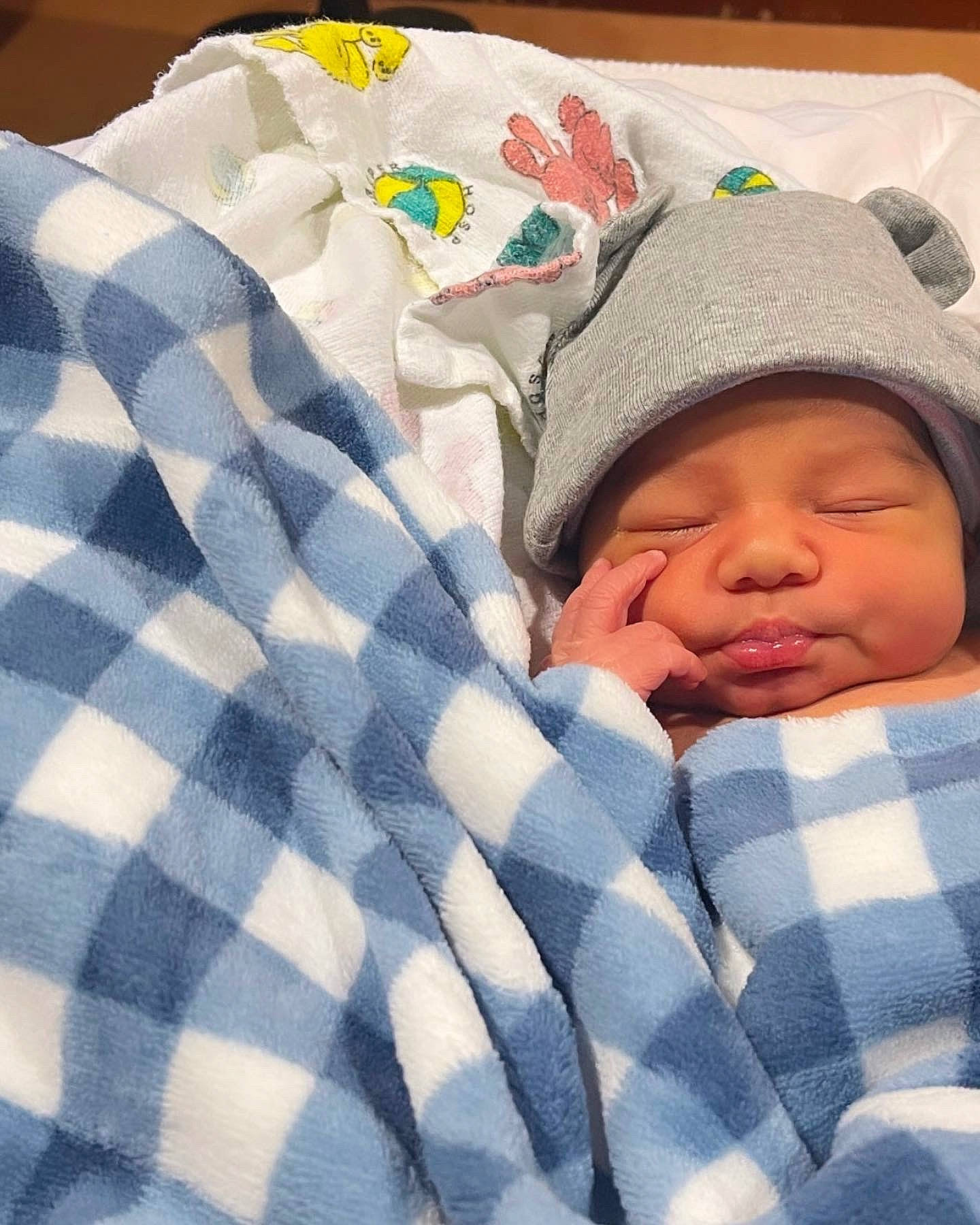 Andrés joined the competition — help win amazing prizes! baby, baby_products, baby_sleeping, baby_toddler_clothing, bedding, bedtime, cap, carmine, child, comfort, hat, headwear, linens, nap, pattern, person, plaid, sleep, sleeve, tartan