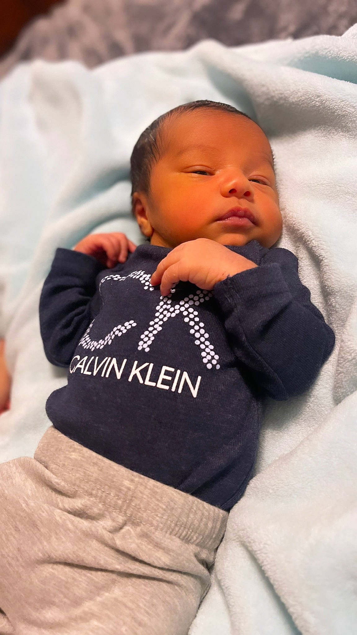 Andrés is registered to the contest to win money with this photo: baby, baby_products, baby_sleeping, baby_toddler_clothing, bedtime, cheek, child, comfort, finger, fur, hand, linens, mouth, nap, nose, person, sitting, skin, sleeve, textile