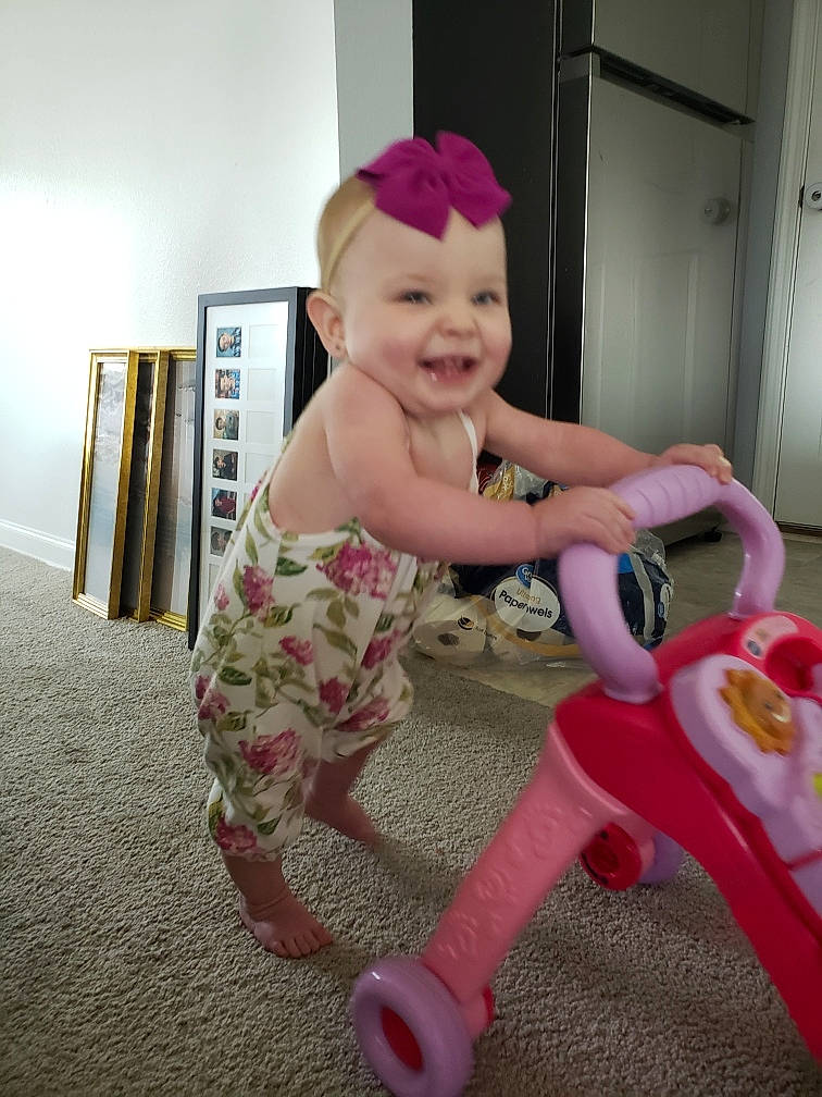 Mckenzie Rain joined the competition — help win amazing prizes! baby, baby_products, baby_toddler_clothing, baby_toys, child, flooring, fun, happy, headwear, joy, magenta, person, picture_frame, pink, riding_toy, room, sitting, smile, sock, thumb