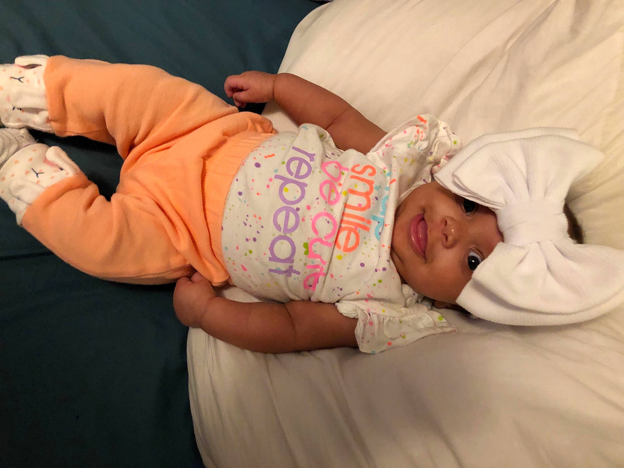 Isla is registered to the contest to win money with this photo: abdomen, baby, baby_products, baby_sleeping, baby_toddler_clothing, child, comfort, couch, elbow, eye, glasses, hat, headgear, human_body, mammal, skin, sleeve, t_shirt, toddler, trunk