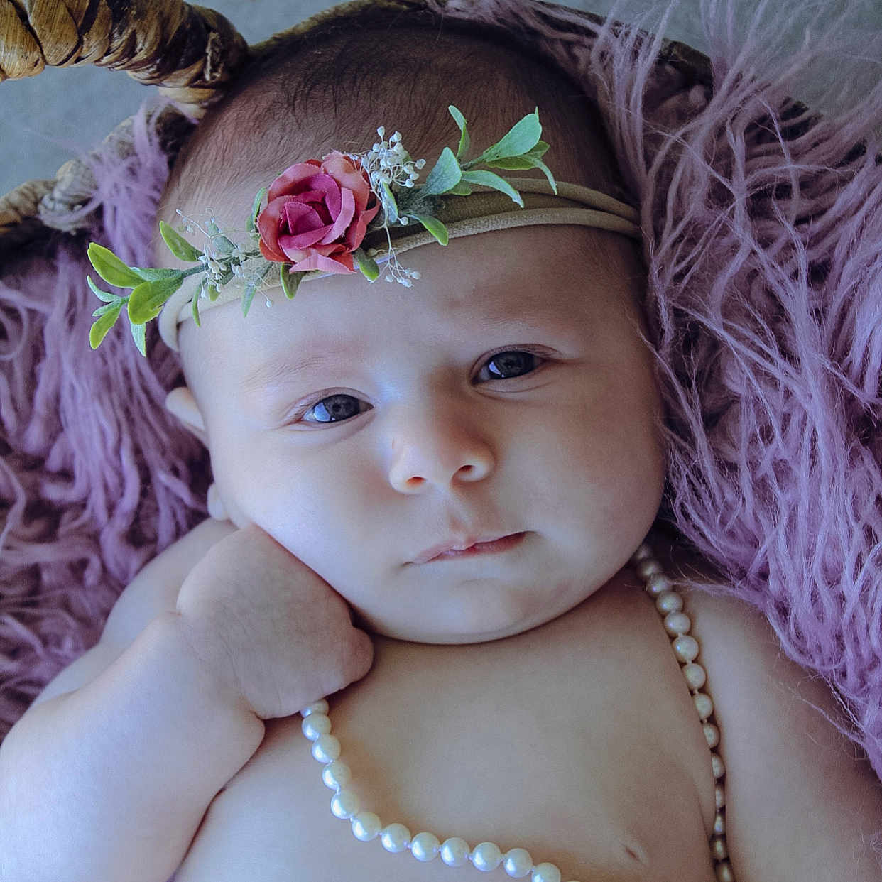 Elsie is registered to the contest to win money with this photo: baby, chin, dress, eye, eyebrow, eyelash, face, flash_photography, flower, grass, hand, happy, head, headgear, iris, petal, pink, plant, skin, toddler