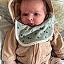 Lyvano a rejoint le concours — aidez-le/la à gagner de superbes lots ! baby, infant, hoodie, bib, clothing, face, expression, cushion, blanket, pants, pattern, dog_print, socks, person, portrait, indoors, cute, cozy, newborn, child