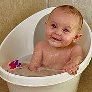 Jackson is registered to the contest to win money with this photo: arm, baby, bath, bathtub, child, child_bath, clean, container, face, happy, head, indoor, plastic, sitting, skin, smile, toddler, toy, water, wet