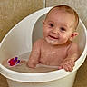 baby, bathtub, bath, child, smile, water, wet, plastic, toy, indoor, happy, skin, face, head, arm, child_bath, clean, sitting, container, toddler