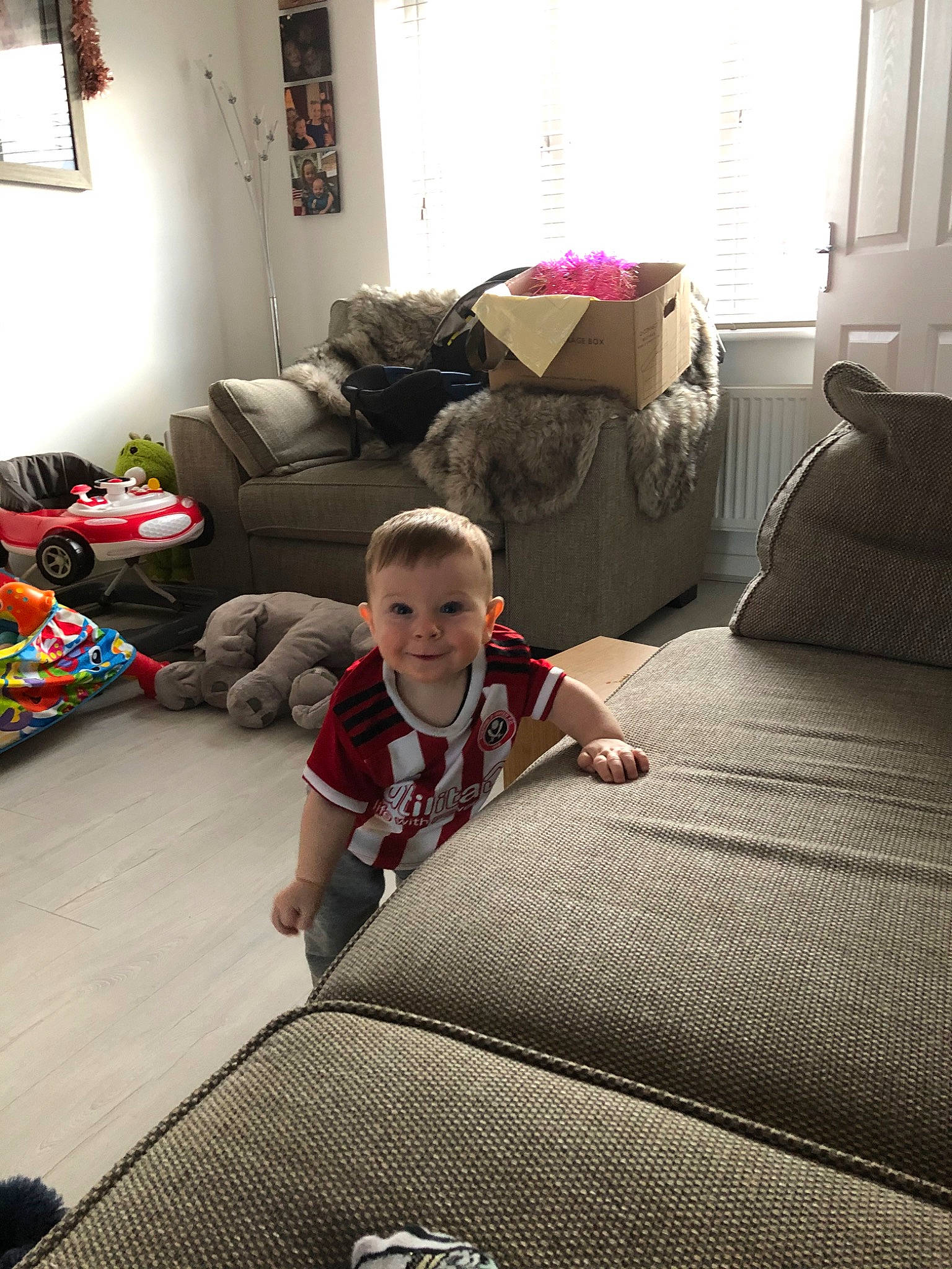 Lenny is registered to the contest to win money with this photo: bed, bed_sheet, bedding, bedroom, blanket, child, comfort, floor, flooring, furniture, home, house, interior_design, linens, mattress, person, play, room, textile, toddler