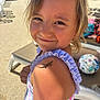 child, smiling, lizard, shoulder, sunlight, outdoor, poolside, swimsuit, person, hair, face, summer, toy, playful, nature, animal, reptile, closeup, happy, skin