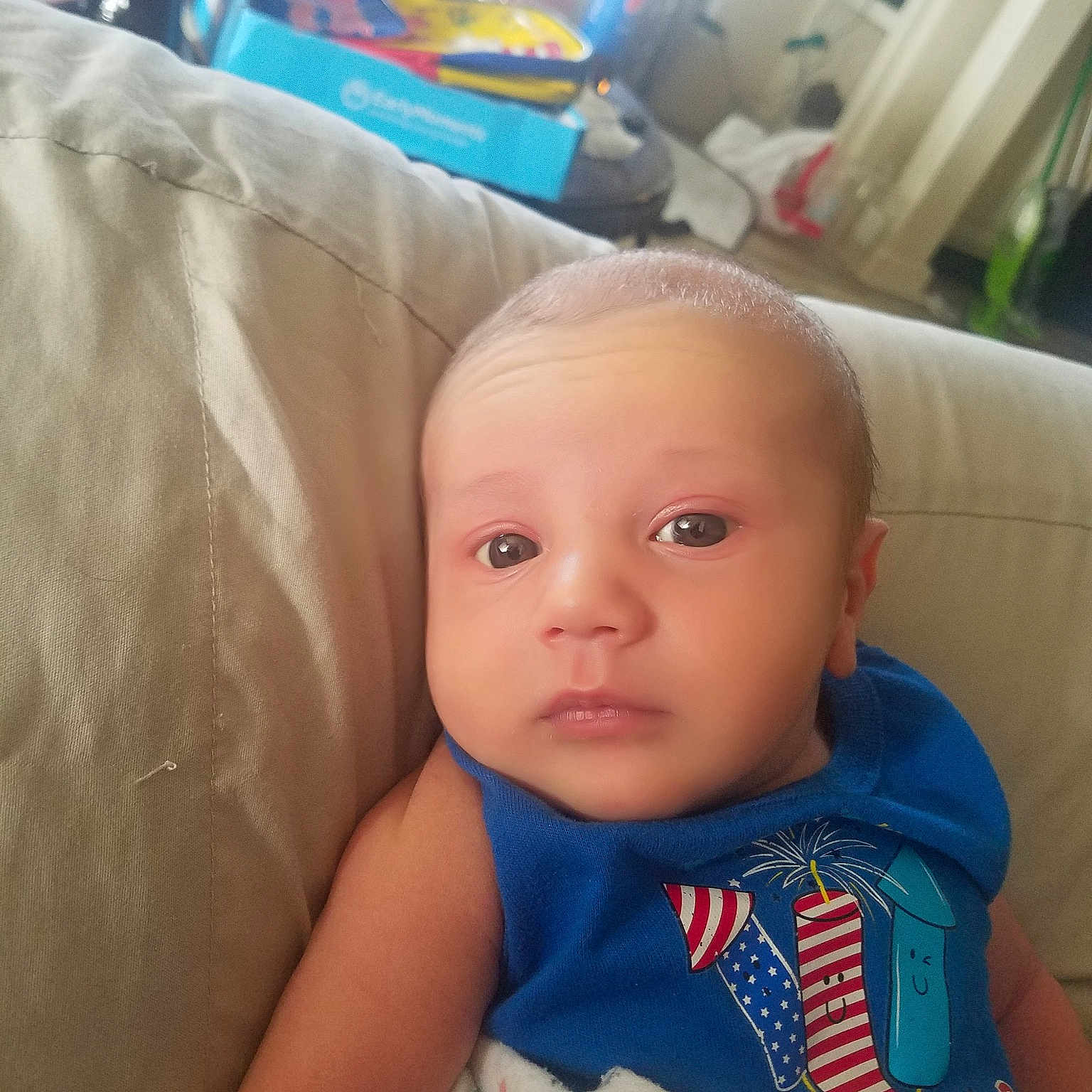 Keaton joined the competition — help win amazing prizes! baby, cheek, child, ear, electronic_device, eye, face, forehead, head, iris, lip, mobile_phone, mouth, nose, person, sitting, skin, smile, technology, toddler