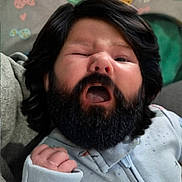 Dean joined the competition — help win amazing prizes! newborn, baby, infant, child, portrait, yawning, sleepy, face, beard, hair, onesie, clothing, crib, blanket, indoor, close_up, patterned_fabric, hand, cozy, photography