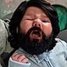 newborn, baby, infant, child, portrait, yawning, sleepy, face, beard, hair, onesie, clothing, crib, blanket, indoor, close_up, patterned_fabric, hand, cozy, photography