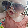 toddler, child, sunglasses, toy, colorful, smiling, porch, outdoor, baby, playtime, fashion, fun, cute, person, summer, sunlight, plastic, seat, casual, happy
