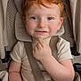 Sandro a rejoint le concours — aidez-le/la à gagner de superbes lots ! toddler, child, red_hair, stroller, seatbelt, beige, curly_hair, smile, hand, face, clothing, baby, indoor, cute, snack, headrest, person, young_child, portrait, seat