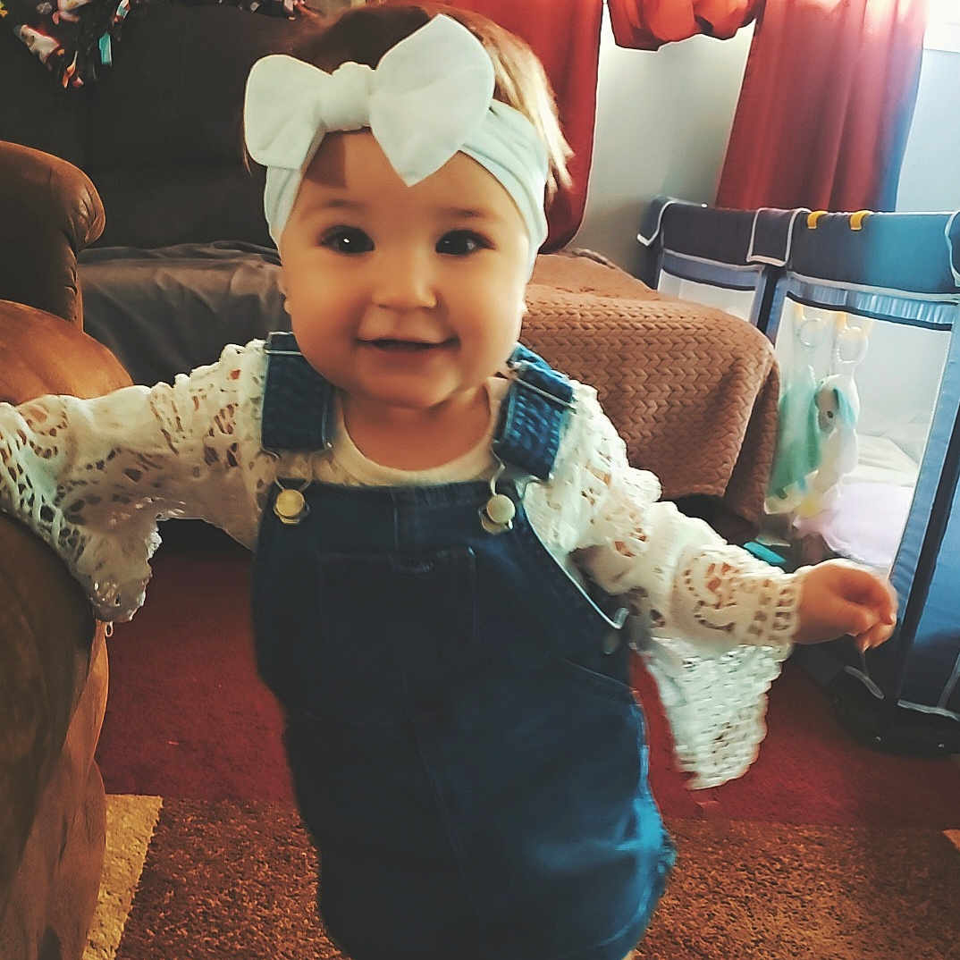 Molly Rose joined the competition — help win amazing prizes! architecture, baby, building, clothing, costume, couch, cushion, dress, face, furniture, hat, head, homedecor, indoors, livingroom, pants, person, photography, portrait, room