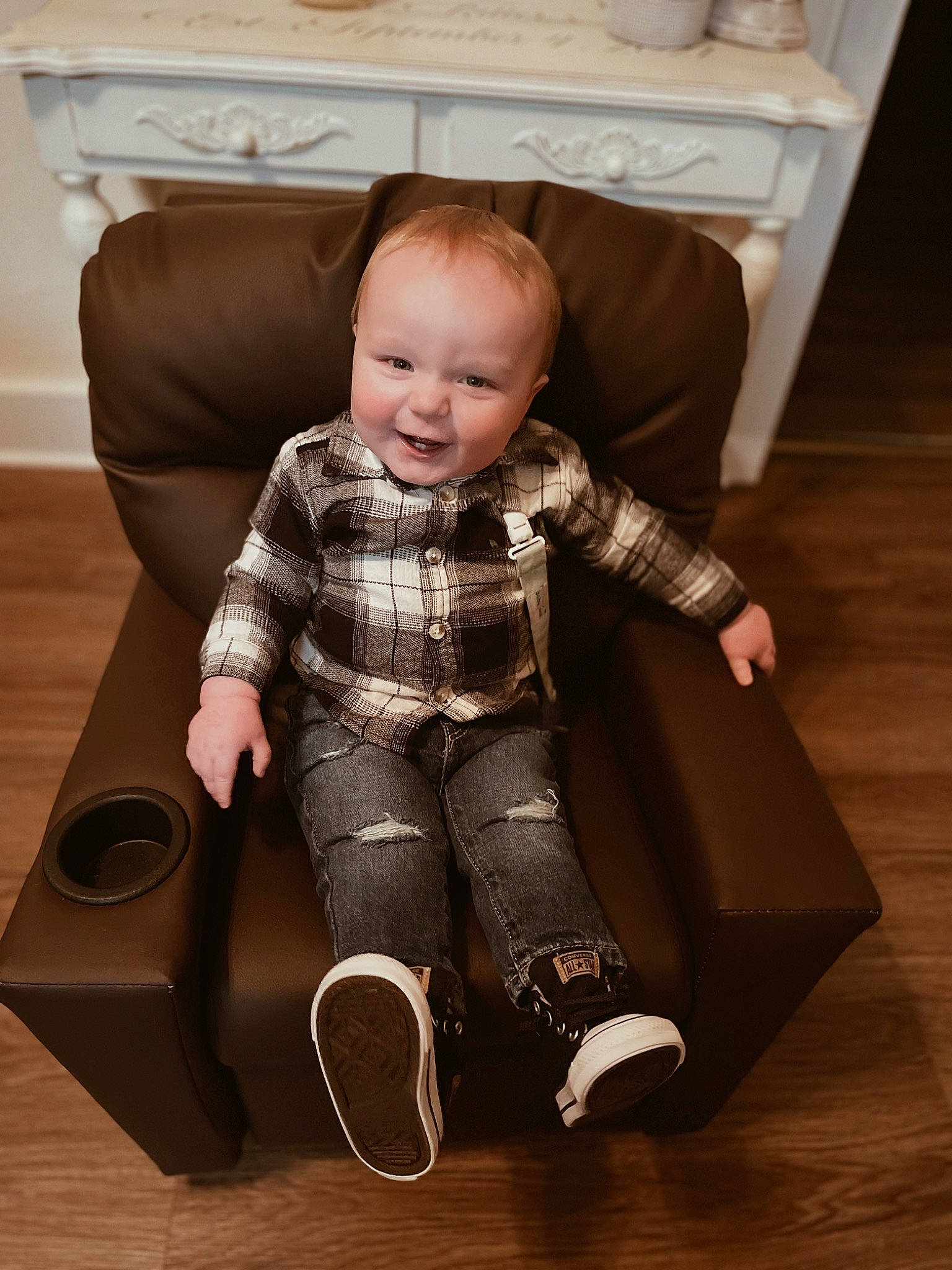 Waylon is registered to the contest to win money with this photo: baby, baby_toddler_clothing, chair, child, comfort, couch, floor, flooring, furniture, hardwood, knee, person, room, sitting, sleeve, sock, standing, stock_photography, thigh, toddler